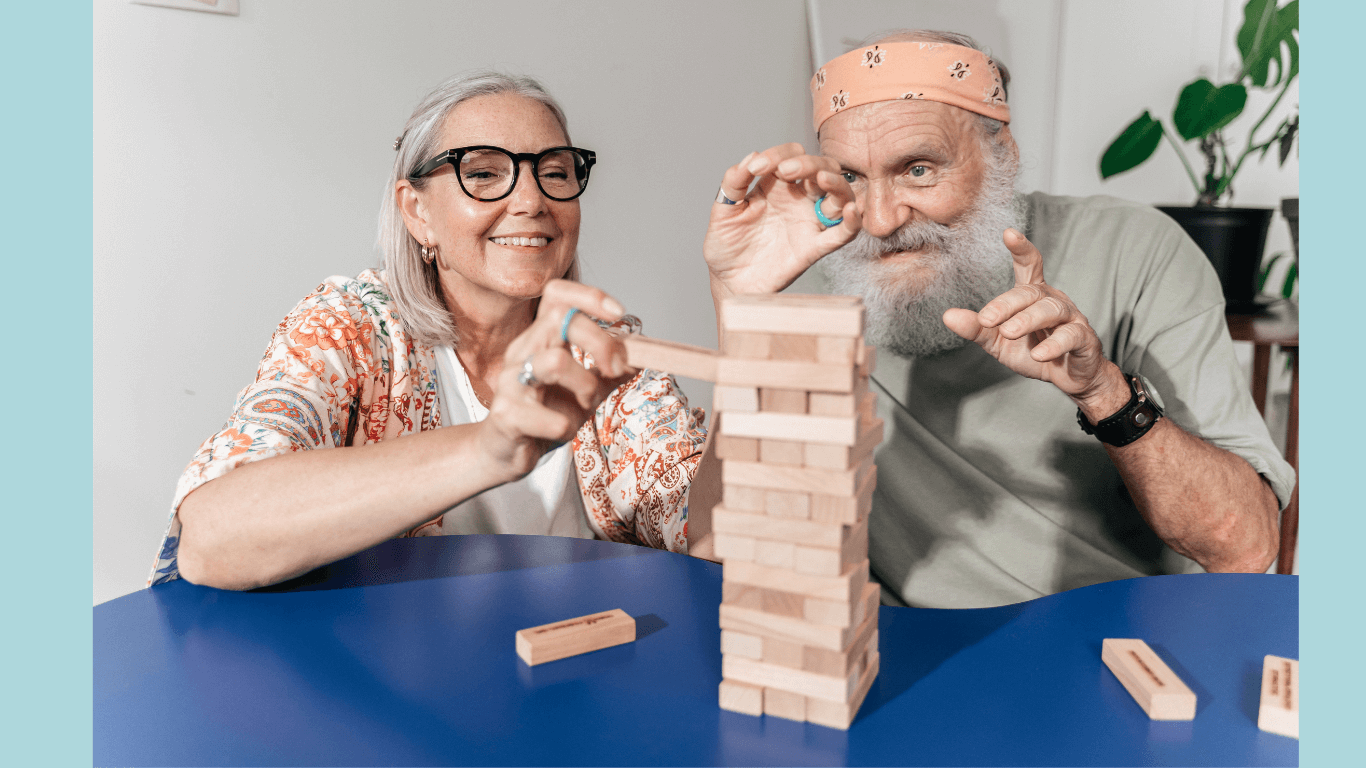 Two elderly playing and doing mental stimulation